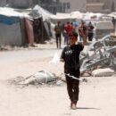 Four children killed as separate attacks in Gaza destroy aid supplies
